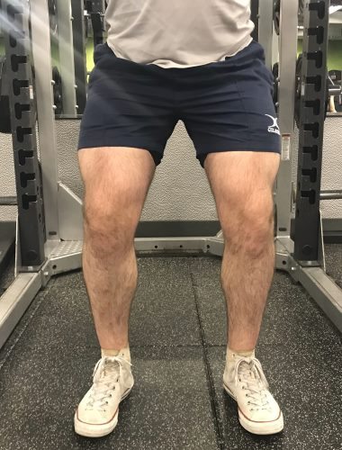 Squatting in Gilbert Rugby Shorts - Front View - Concentric Rep