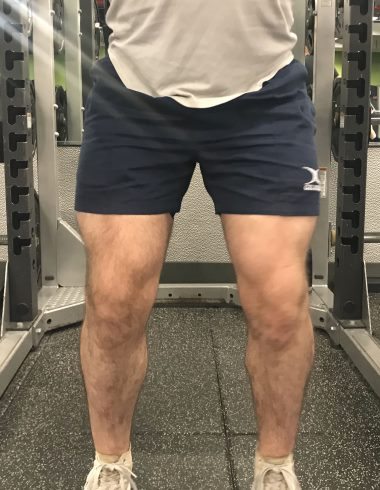 Squatting in Gilbert Rugby Shorts - Front View - Top of Squat Rep