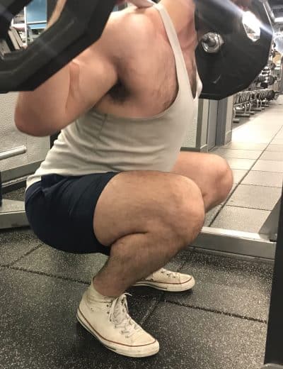 Squatting in Gilbert Rugby Shorts - Side View - Bottom of Squat Rep