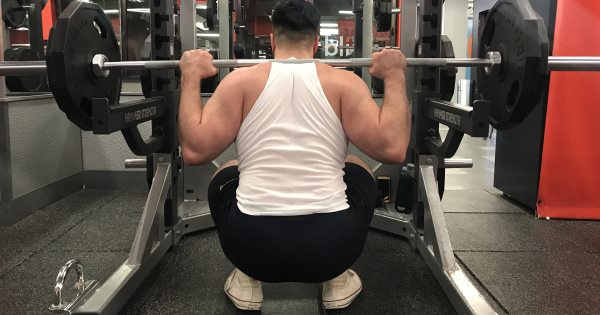 Squatting in Jed North Fitted Lifting Shorts - Rear View - Bottom of Squat Rep