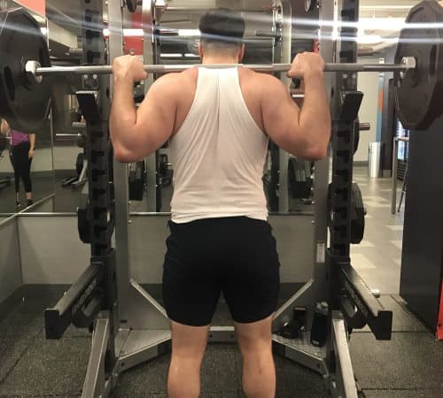 Squatting in Jed North Fitted Lifting Shorts - Rear View - Top of Squat Rep