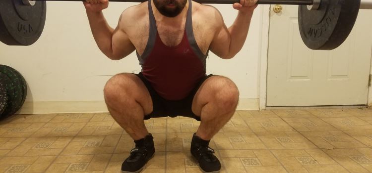 Squatting in A7 Center-stretch Shorts - Front View - Bottom of Squat Rep