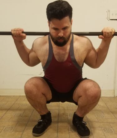 Squatting in A7 Center-stretch Shorts - Front View - Bottom of Squat Rep - Closeup