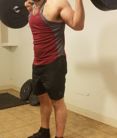 Squatting in A7 Center-stretch Shorts - Side View - Top of Squat Rep