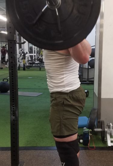 Squatting in Young LA Lifting Shorts - Side View - Top of Squat