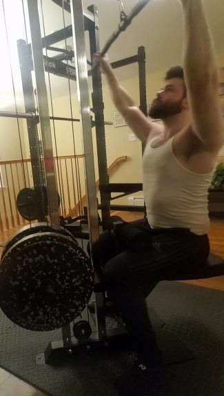 Force USA MyRack Doing Lat Pulldowns on Cable Crossover Attachment