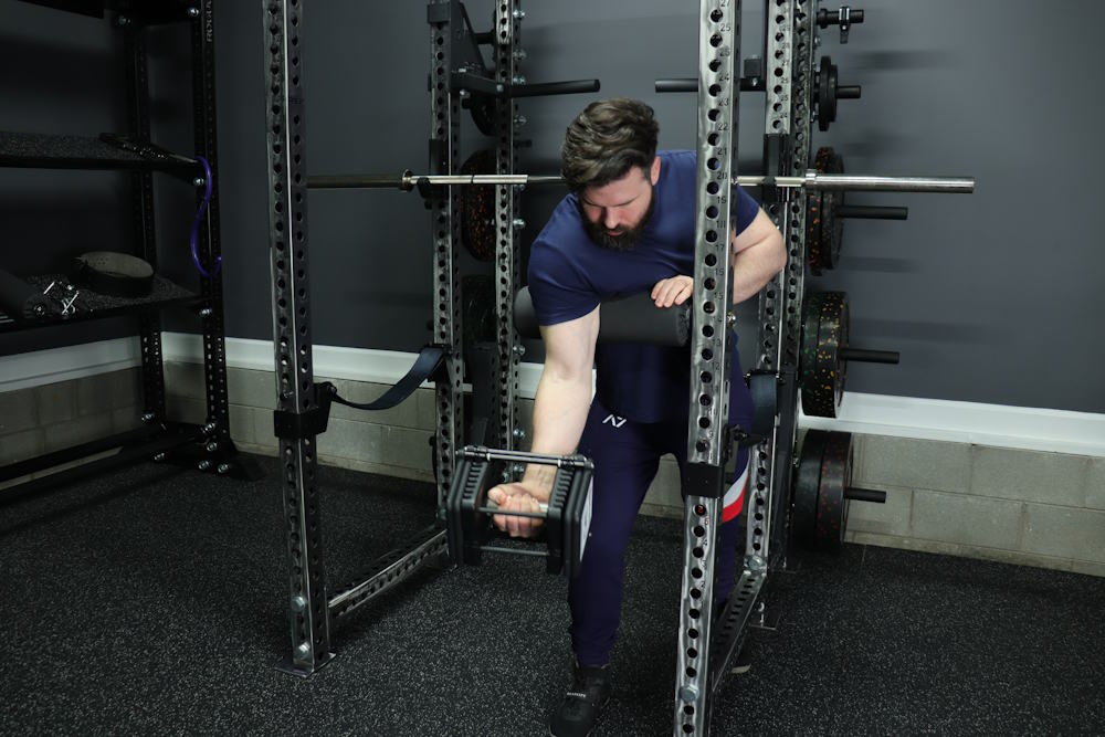 Dumbbell Preacher Curls Using a REP Leg Roller as a Makeshift Preacher Pad