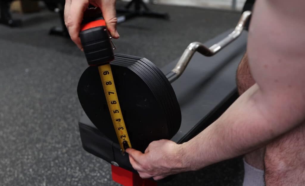 Plate Diameter Being Measured on the MX Select MX100 Adjustable Barbell