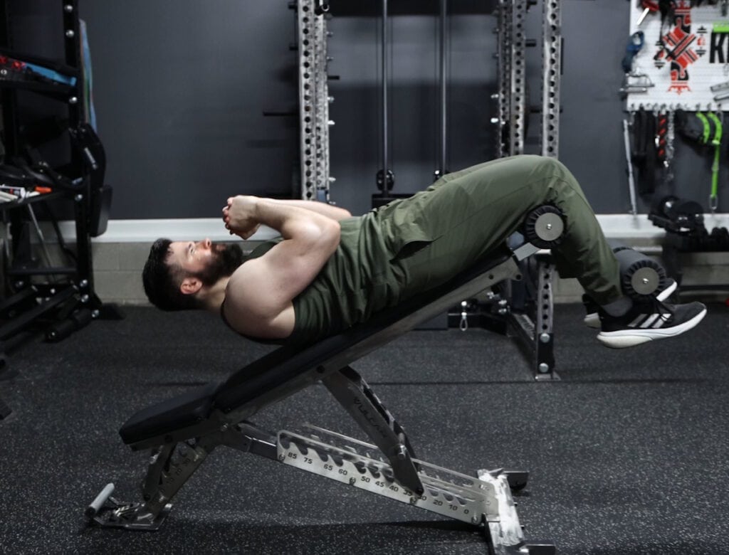 Decline Sit Ups With the Leg Roller Attachment on the Vulcan M-61 Multi-Bench