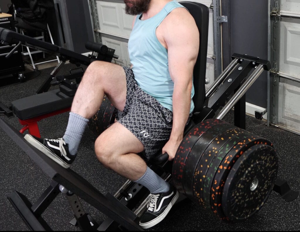 Bumper Plates Filling Entier Weight Sleeve on the Force USA Compact Leg Press & Hack Squat