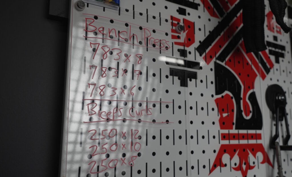 Dry-Erase Board and Markers for Workout Tracking in Home Gym