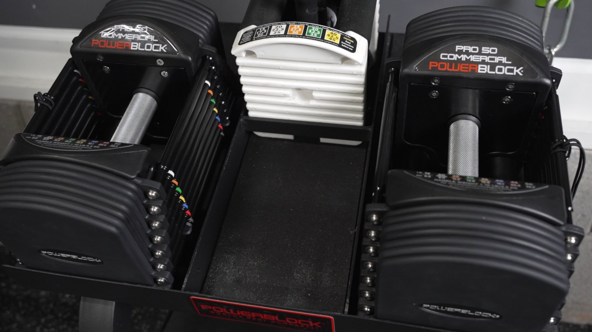 PowerBlock Commercial Pro 50 Review - Closeup of the Commercial Pro 50 Adjustable Dumbbells in the Pro Rack Stand