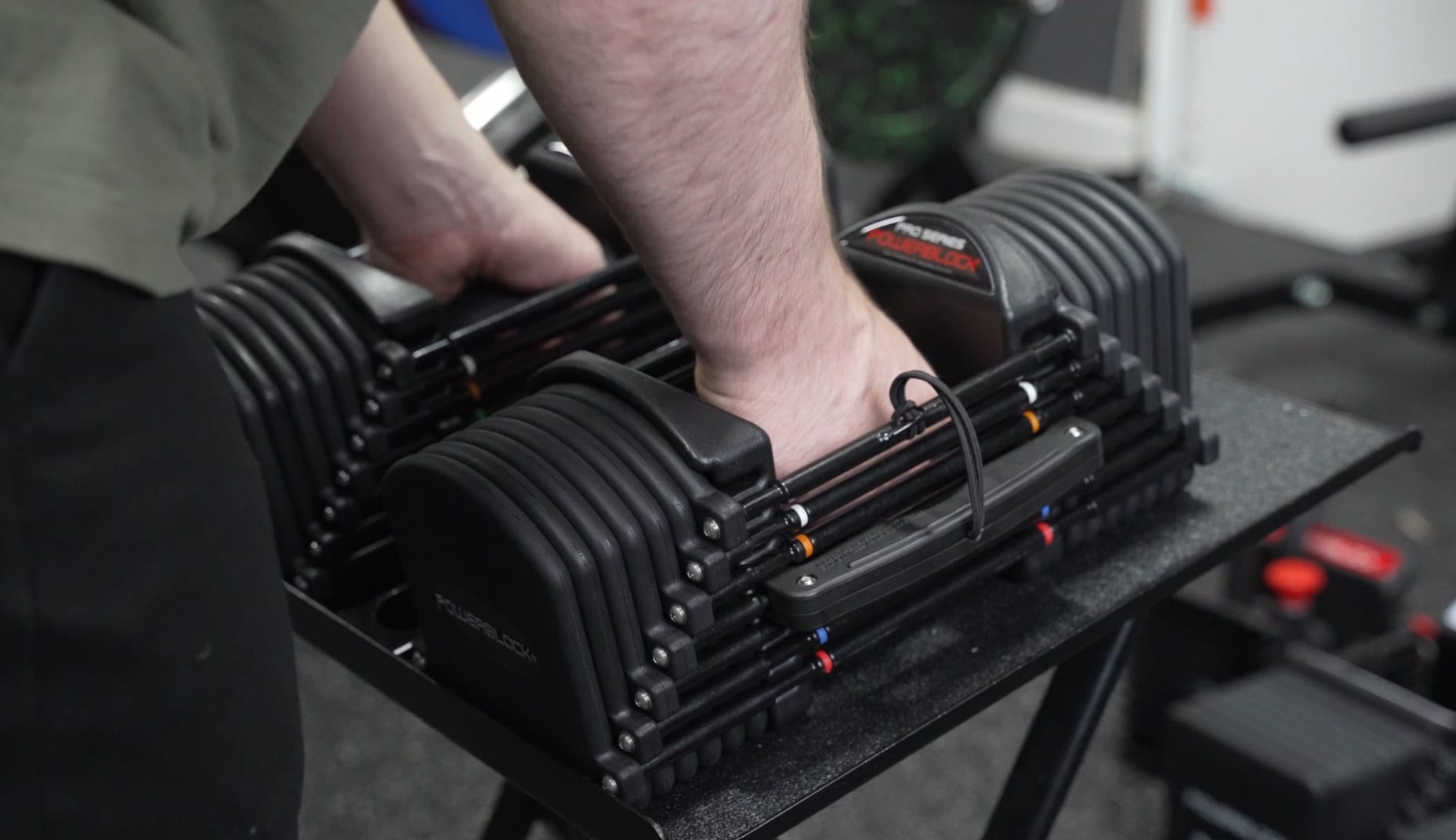 Grabbing the PowerBlock Pro 32 Dumbbells Before a Set
